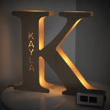 Personalized wooden letter K night light with KAYLA engraved, warm glow, 19CM, custom name lamp.
